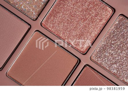 New glitter rose gold and beige matte eyeshadow macro photo. Cosmetic texture banner background 98381959