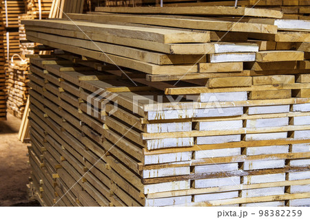 Warehouse packed with variety of timber for construction and repair. Wood timber construction material 98382259