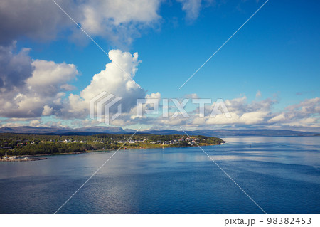 View of the fjord and village on a summer sunny day View of the fjord and village on a summer sunny day 98382453