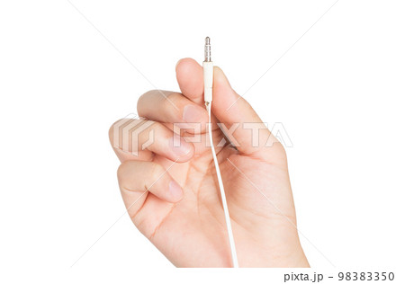 closeup hand holding headphone cable 98383350