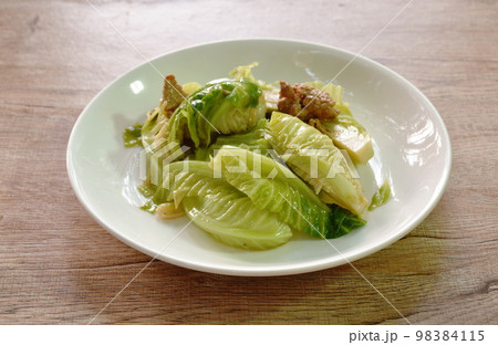 fried Brussels sprout with slice pork in oyster sauce on plate  98384115