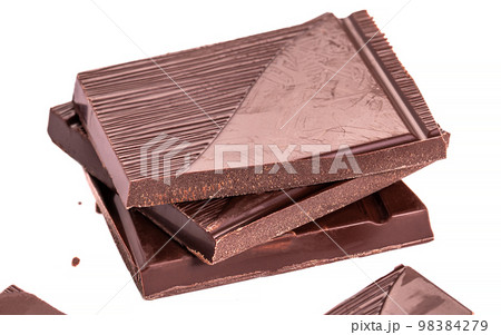 Close up pieces of chocolate on a white background, dessert isolated, health concept Close up pieces of chocolate on a white background, dessert isolated, health concept 98384279
