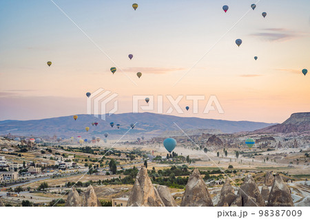 Colorful hot air balloon flying over Cappadocia, Turkey Colorful hot air balloon flying over Cappadocia, Turkey 98387009