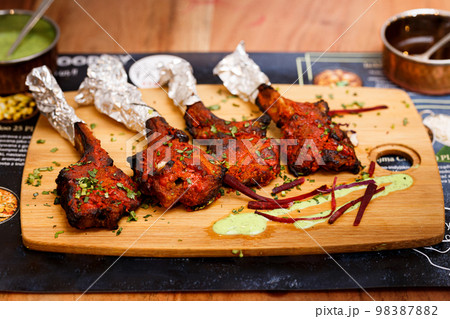 Grilled Lamb Lollipop Chops With Green Goddess Dipping Sauce 98387882