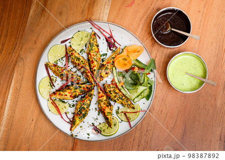 Chicken rolls prepared according to an Indian recipe. Chicken rolls prepared according to an Indian recipe. 98387892