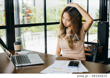 Businesswoman freelance suffering from neck ache pain caused by long time laptop usage, Tired office female sitting at desk touching massaging stiff neck while holding her head in cafe coffee shop Businesswoman freelance suffering from neck ache pain caused by long time laptop usage, Tired office female sitting at desk touching massaging stiff neck while holding her head in cafe coffee shop 98389826