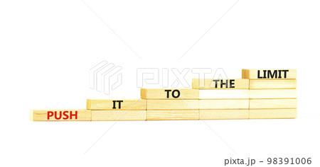 Push it to the limit symbol. Concept words Push it to the limit on wooden blocks. Beautiful white table white background. Business push it to the limit concept. Copy space. Push it to the limit symbol. Concept words Push it to the limit on wooden blocks. Beautiful white table white background. Business push it to the limit concept. Copy space. 98391006