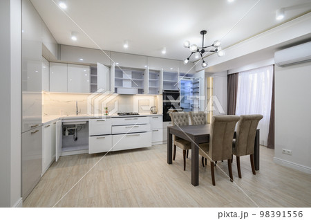 White modern new well designed white kitchen in studio flat interior White modern new well designed white kitchen in studio flat interior 98391556
