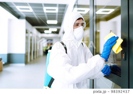 Cleaning and disinfection of office to prevent COVID-19. Prevention of spreading pneumonia virus. 98392437