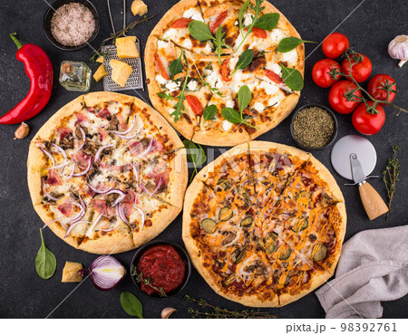 Assortment of various types of Italian pizza 98392761
