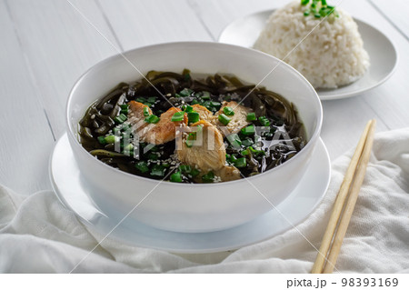 Korean seaweed soup with meat in white bowl and boiled rice. Birthday soup. Traditional Korean Cuisine. Healthy diet. Pregnancy. Custom. Korean seaweed soup with meat in white bowl and boiled rice. Birthday soup. Traditional Korean Cuisine. Healthy diet. Pregnancy. Custom. 98393169