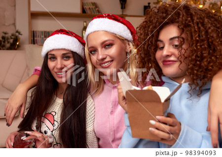 Bachelorette party for christmas, several beautiful girls celebrate christmas, eat food, play games, celebrate christmas Bachelorette party for christmas, several beautiful girls celebrate christmas, eat food, play games, celebrate christmas 98394093