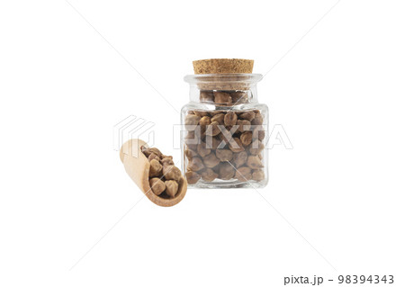 brown chickpeas in wooden scoop and glass jar on isolated on white background. nutrition. food ingredient. brown chickpeas in wooden scoop and glass jar on isolated on white background. nutrition. food ingredient. 98394343