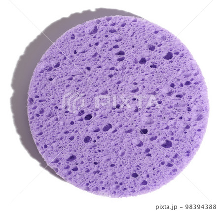Round purple makeup sponge on a white isolated background, top view Round purple makeup sponge on a white isolated background, top view 98394388