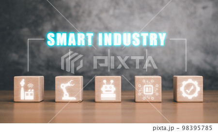 Smart industry 4.0 concept, Wooden block on desk with smart industry icon on virtual screen. Smart industry 4.0 concept, Wooden block on desk with smart industry icon on virtual screen. 98395785