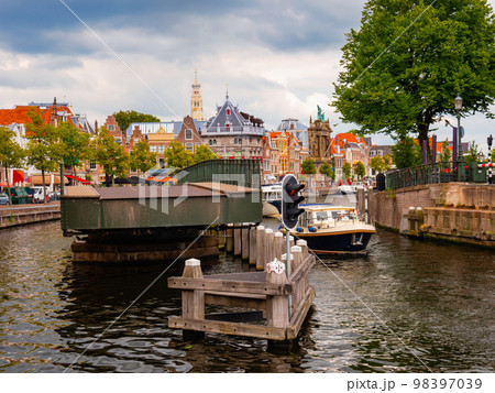 View of Catharijnebrug swing bridge over Spaarne with passing boats in Haarlem View of Catharijnebrug swing bridge over Spaarne with passing boats in Haarlem 98397039