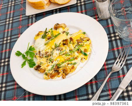Popular breakfast of Spanish cuisine is Revuelto Popular breakfast of Spanish cuisine is Revuelto 98397361