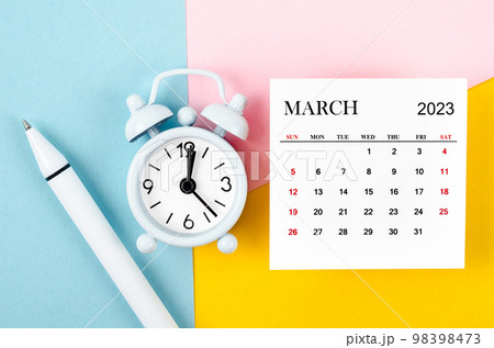 The March 2023 Monthly calendar with alarm clock and pen on beautiful background. The March 2023 Monthly calendar with alarm clock and pen on beautiful background. 98398473