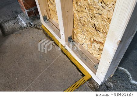 Close up detail of house construction wooden wall elements. Interior frame renovation work 98401337