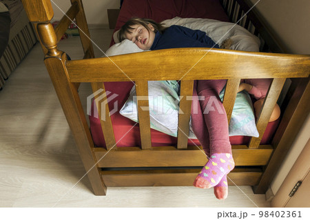 Beautiful adorable little girl child is sleeping in bed. Dreamy colorized and soft focus quiet photo. Beautiful adorable little girl child is sleeping in bed. Dreamy colorized and soft focus quiet photo. 98402361