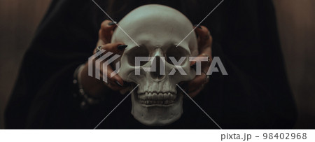 skull of a dead man in the hands of a witch witch skull of a dead man in the hands of a witch witch 98402968
