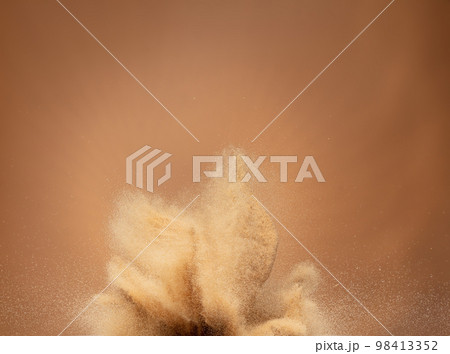 Small Fine size Sand flying explosion, Golden grain wave explode, abstract cloud fly. Yellow colored sand splash throwing in Air. Aura wallpaper background high speed shutter, freeze stop motion Small Fine size Sand flying explosion, Golden grain wave explode, abstract cloud fly. Yellow colored sand splash throwing in Air. Aura wallpaper background high speed shutter, freeze stop motion 98413352