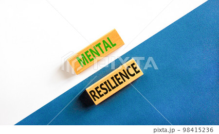 Mental resilience symbol. Concept word Mental resilience typed on wooden blocks. Beautiful white and blue paper background. Business psychological and mental resilience concept. Copy space. 98415236