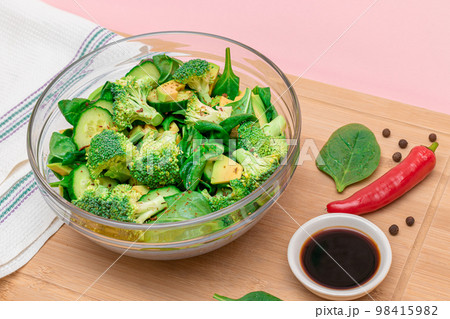 Fresh Green Salad of Avocado, Broccoli, Spinach and Cucumber Fresh Green Salad of Avocado, Broccoli, Spinach and Cucumber 98415982