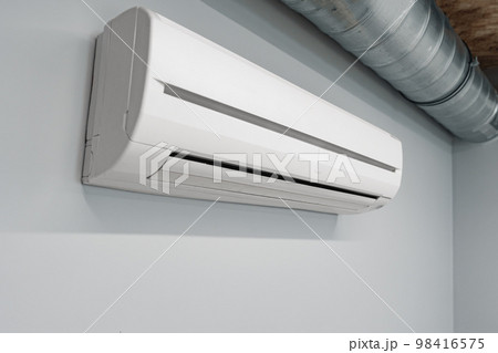 Air conditioner on gray wall room interior Air conditioner on gray wall room interior 98416575