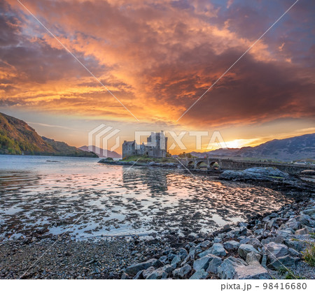 Colorful sunset against Eilean Donan Castle at Kyle of Lochalsh in the Western Highlands of Scotland 98416680