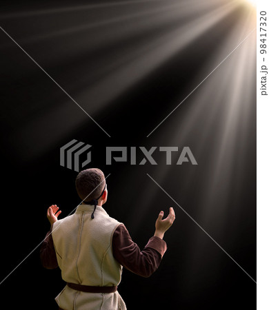 Praying man with raised hands Praying man with raised hands 98417320