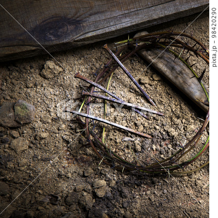 Rusty nails and a wreath of thorns at the cross Rusty nails and a wreath of thorns at the cross 98420290