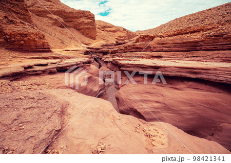 Dry riverbed. Desert nature landscape. Sandstone background. Red Canyon, Eilat, Israel 98421341