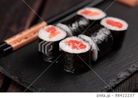 Maki sushi rolls with smoked salmon - Sushi menu. Japanese food concept 98422237