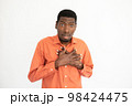 Portrait of ashamed young man touching chest 98424475