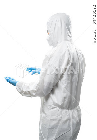 Worker wears medical protective suit or white coverall suit hand extend isolated on white 98429132