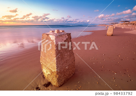 Sunset over the beach. Evening on the empty beach in Caesarea, Israel 98433792