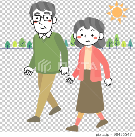 Senior couple walking in the green while soaking up the sunlight 98435547