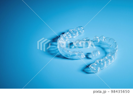 Plastic dental orthodontics on colored background. No people 98435650