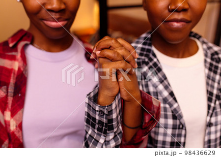 two women staying at home and spending great evening 98436629