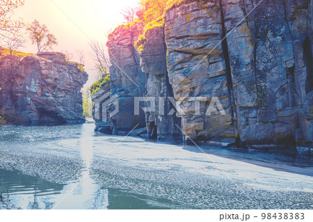 View to a mountain river in early spring. Rocky riverbanks View to a mountain river in early spring. Rocky riverbanks 98438383