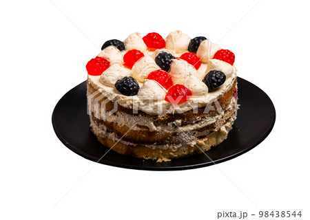 Delicious birthday layer cake filled with mascarpone cream and decorated jelly sweets on isolated background 98438544