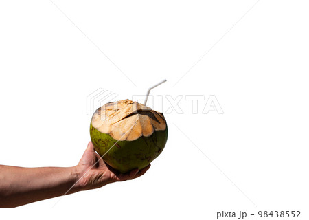 Male hand holds coconut cocktail on isolated background 98438552