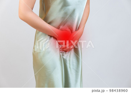 Menstrual pain, woman with stomachache suffering from pms , endometriosis, cystitis and other diseases of the urinary system, painful area highlighted in red 98438960