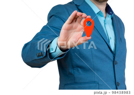 Businessman holding a red location pin pointer Businessman holding a red location pin pointer 98438983