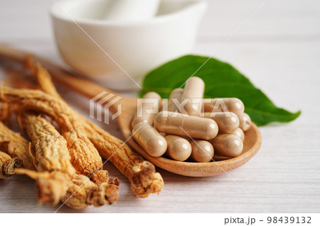 Ginseng roots and green leaf, healthy food. Ginseng roots and green leaf, healthy food. 98439132