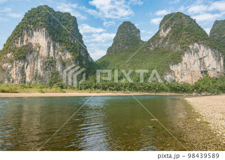 Karst hills by Li River near Xingping. Karst hills by Li River near Xingping. 98439589