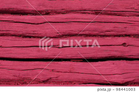 Natural time-aged wood background in the colors of the new year 2023 Viva Magenta 98441003