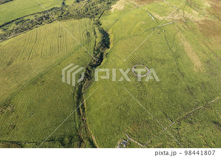 Aerial views of ruins and round sheepfolds at Gortmore in Northern Ireland 98441807