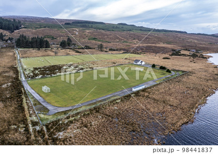 Aerial view of the GAA pitch next to Mount Errigal in Donegal - Ireland. 98441837